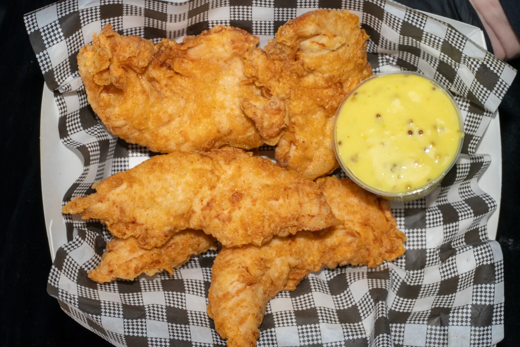 Chicken tenders with dipping sauce photographed for menu content