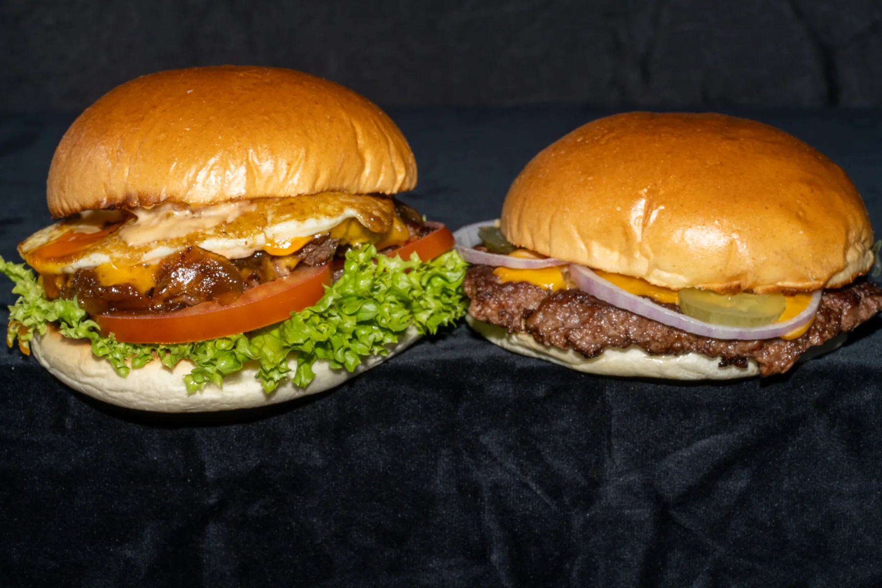 Two burgers photographed together for menu content