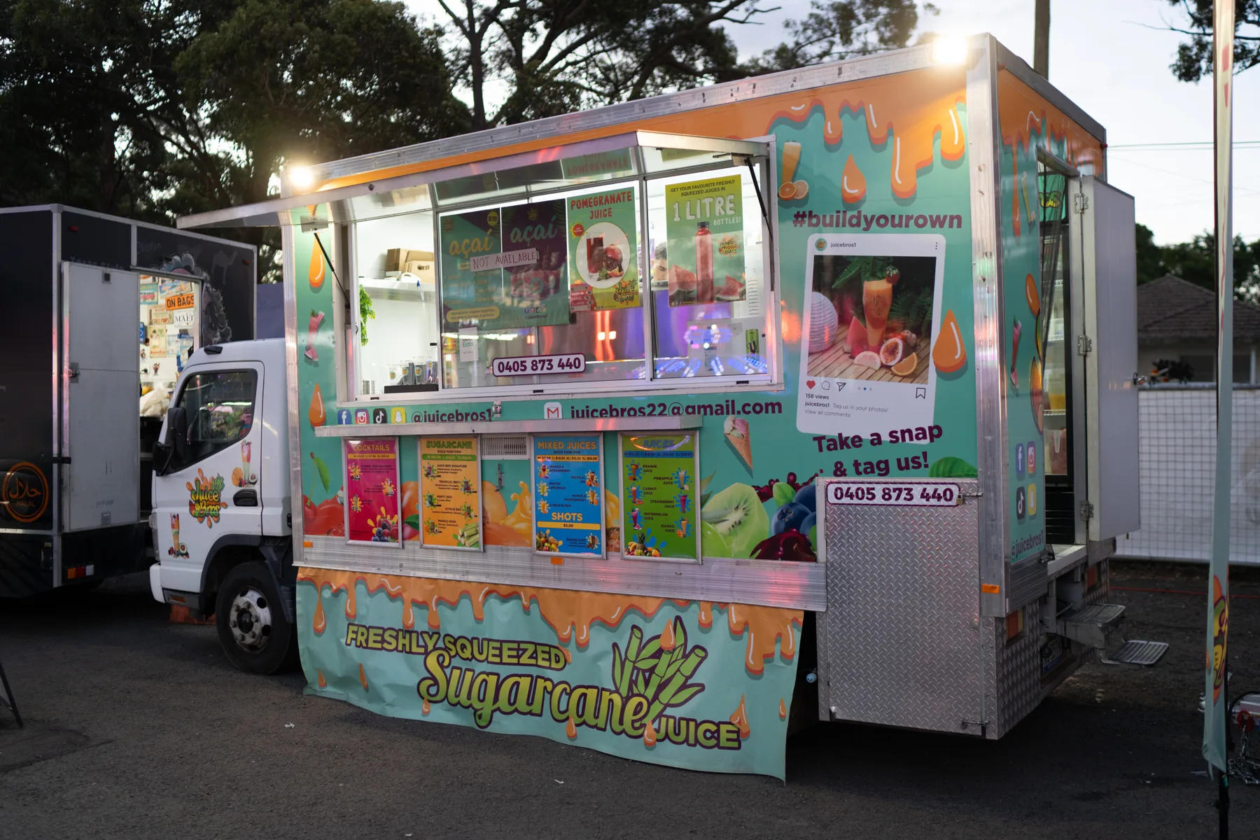 Lit food truck photographed during evening vendor coverage