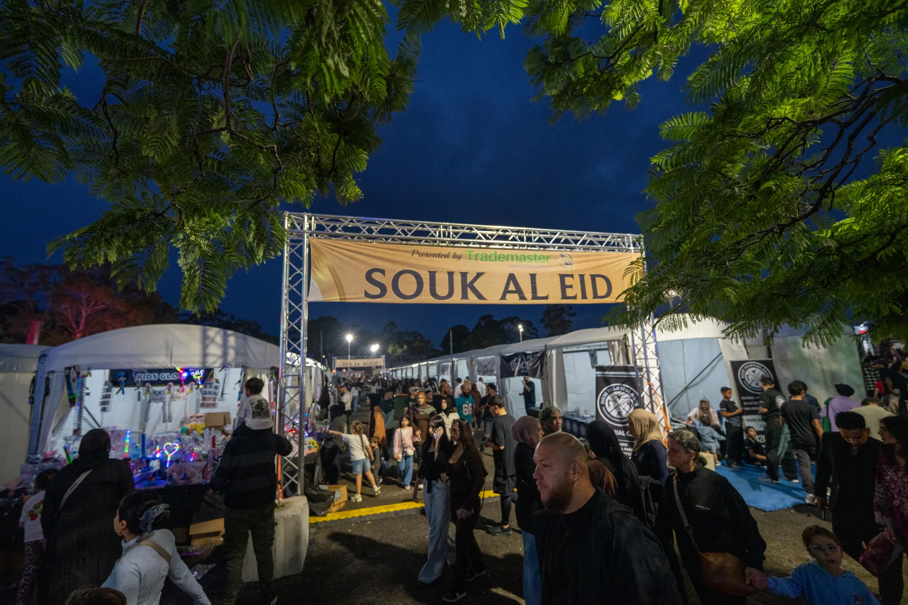 Night market entry photographed with event lighting