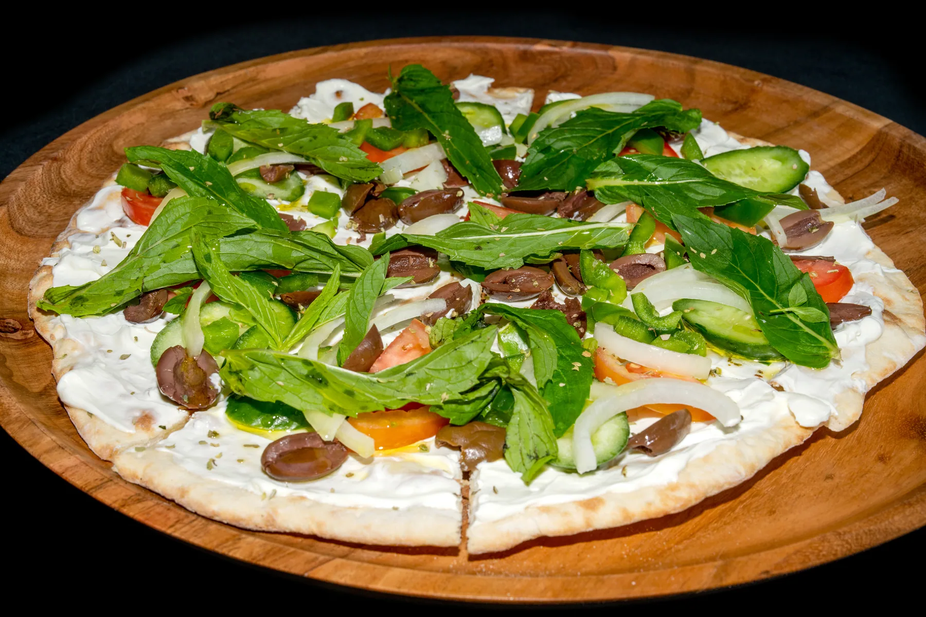 Garnished flatbread photographed for restaurant menu content