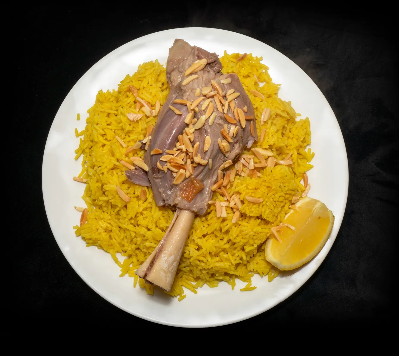 Lamb kabseh photographed on a dark food backdrop