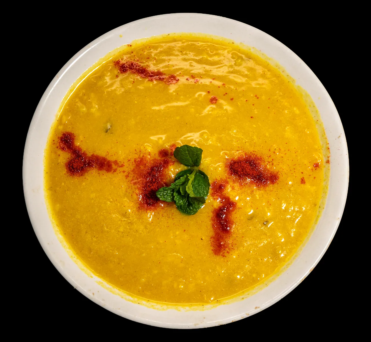 Lentil soup photographed from above for menu content