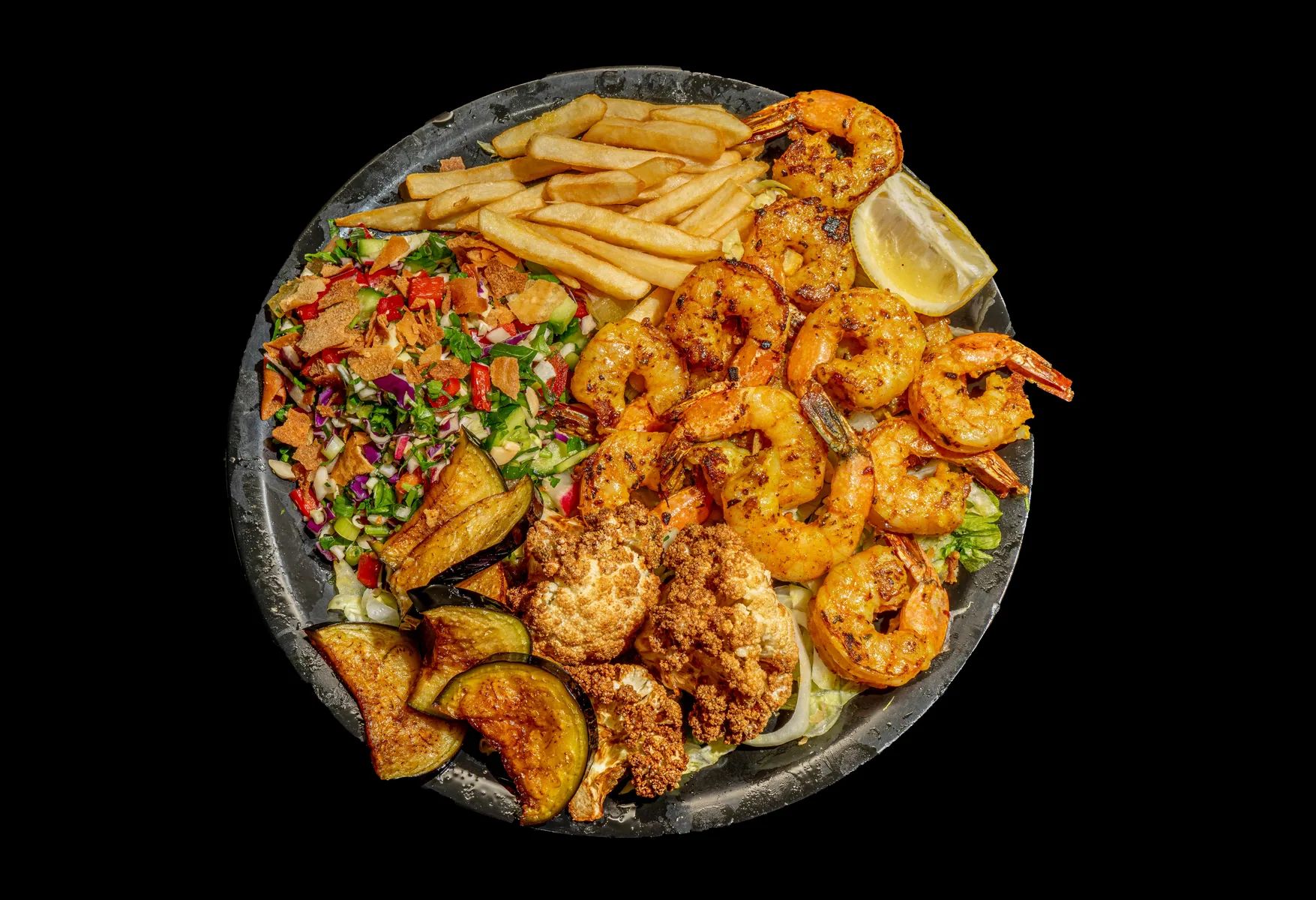 Prawn plate photographed with chips and salad for a menu image